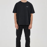 Man wearing a black t-shirt and pants on a white background