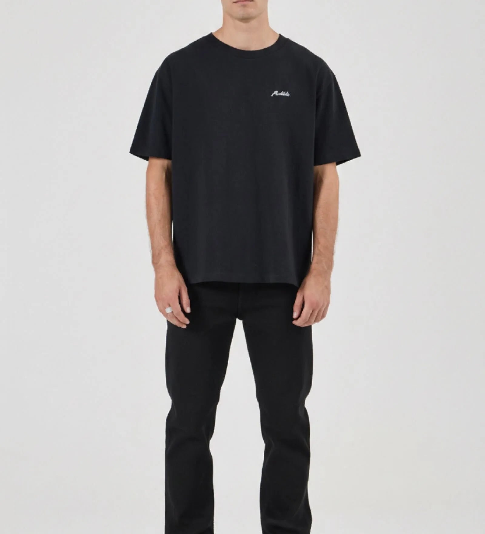 Man wearing a black t-shirt and pants on a white background