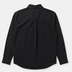 A black long-sleeve button-up shirt shown from the back, featuring a subtle vertical pleat down the center back, laid flat against a light gray background.