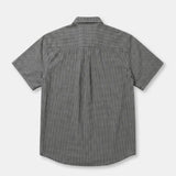 A short-sleeve button-up shirt with a small-scale black and white micro-check pattern, shown from the back on a light gray background.