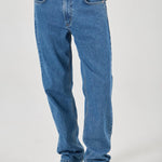Person wearing blue jeans on a white background