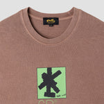 Brown t-shirt with green and black graphic design on a white background