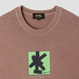 Brown t-shirt with green and black graphic design on a white background