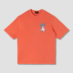 Orange t-shirt with a graphic design on a light gray background