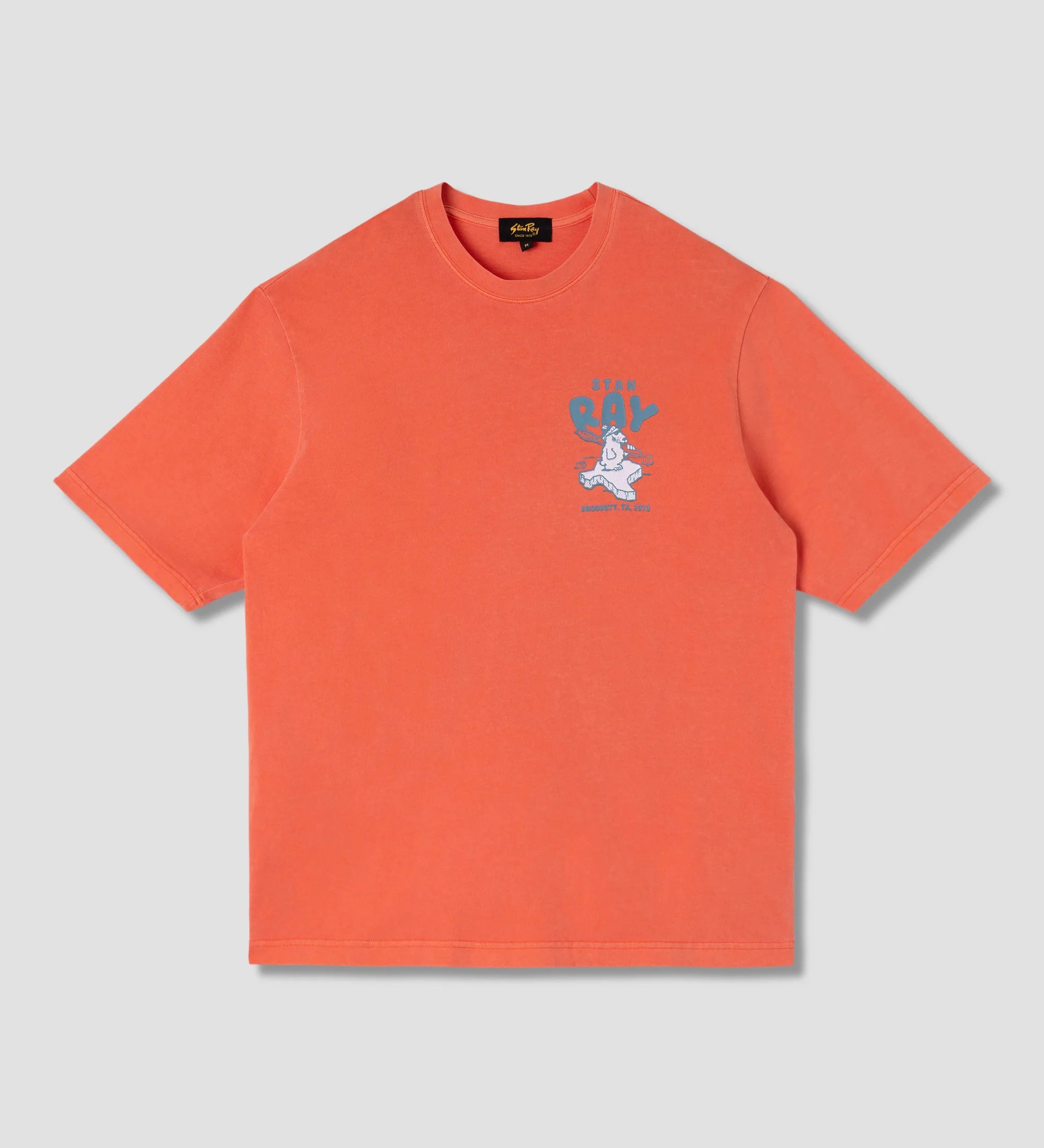 Orange t-shirt with a graphic design on a light gray background