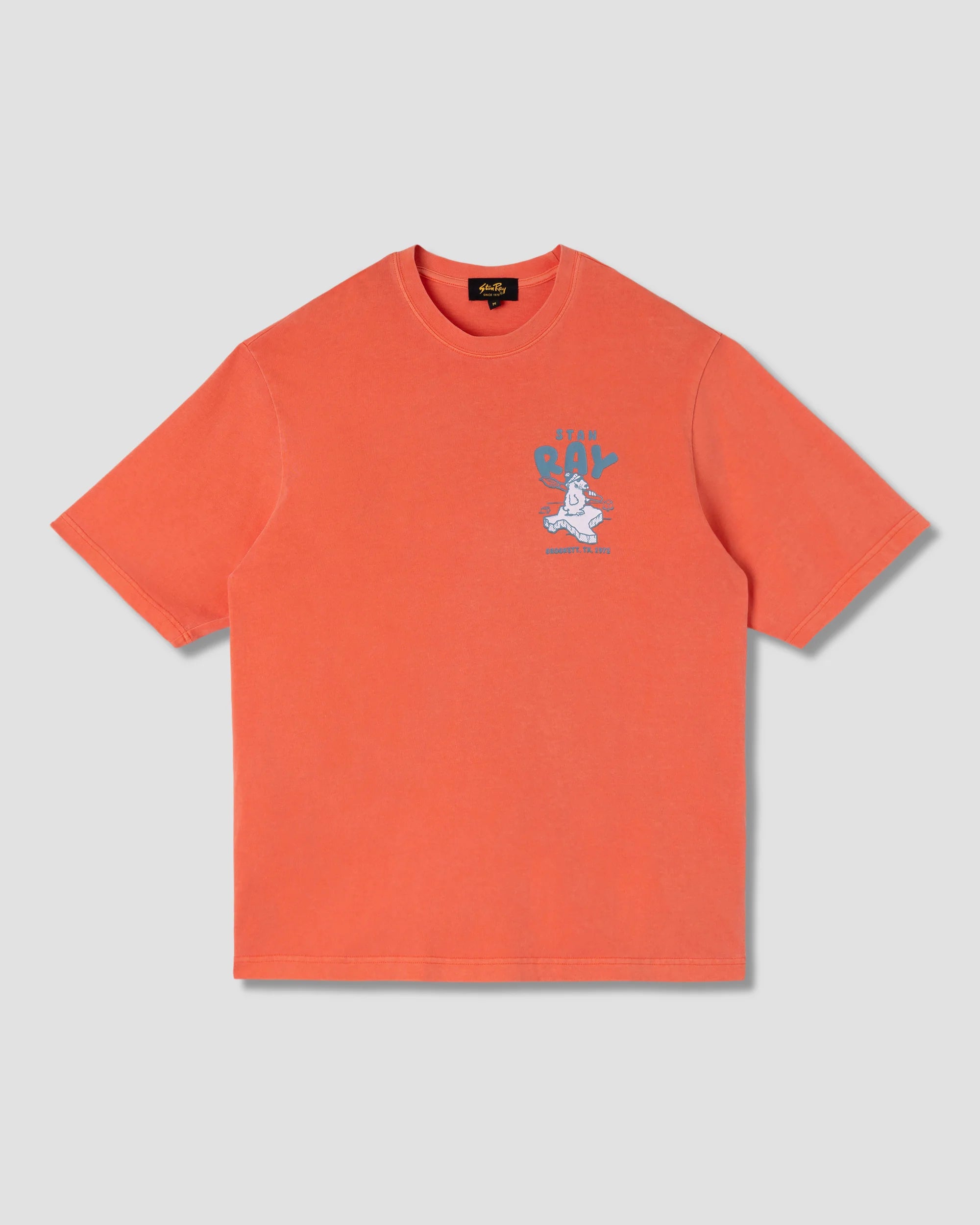 Orange t-shirt with a graphic design on a light gray background