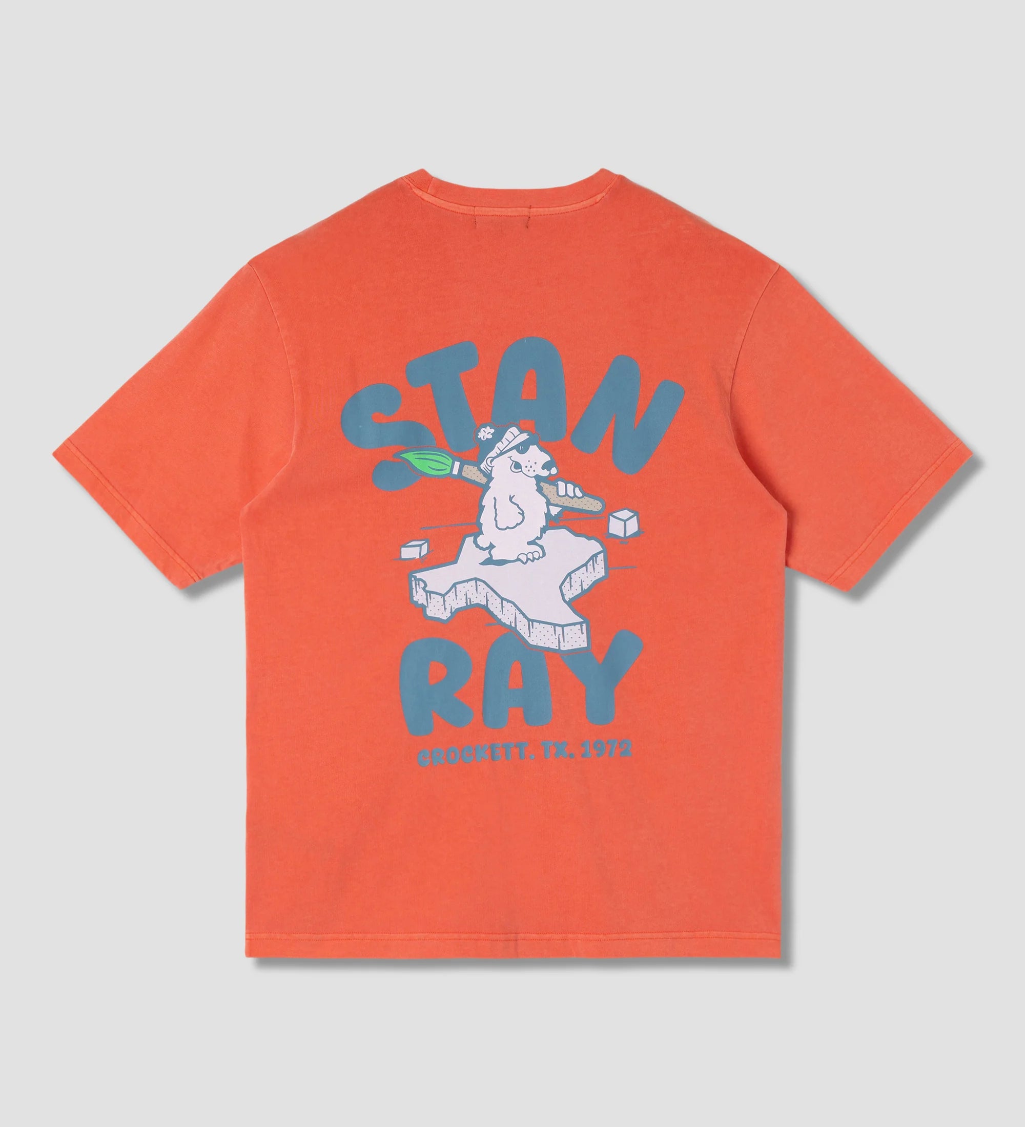Orange t-shirt with graphic design and text on a gray background