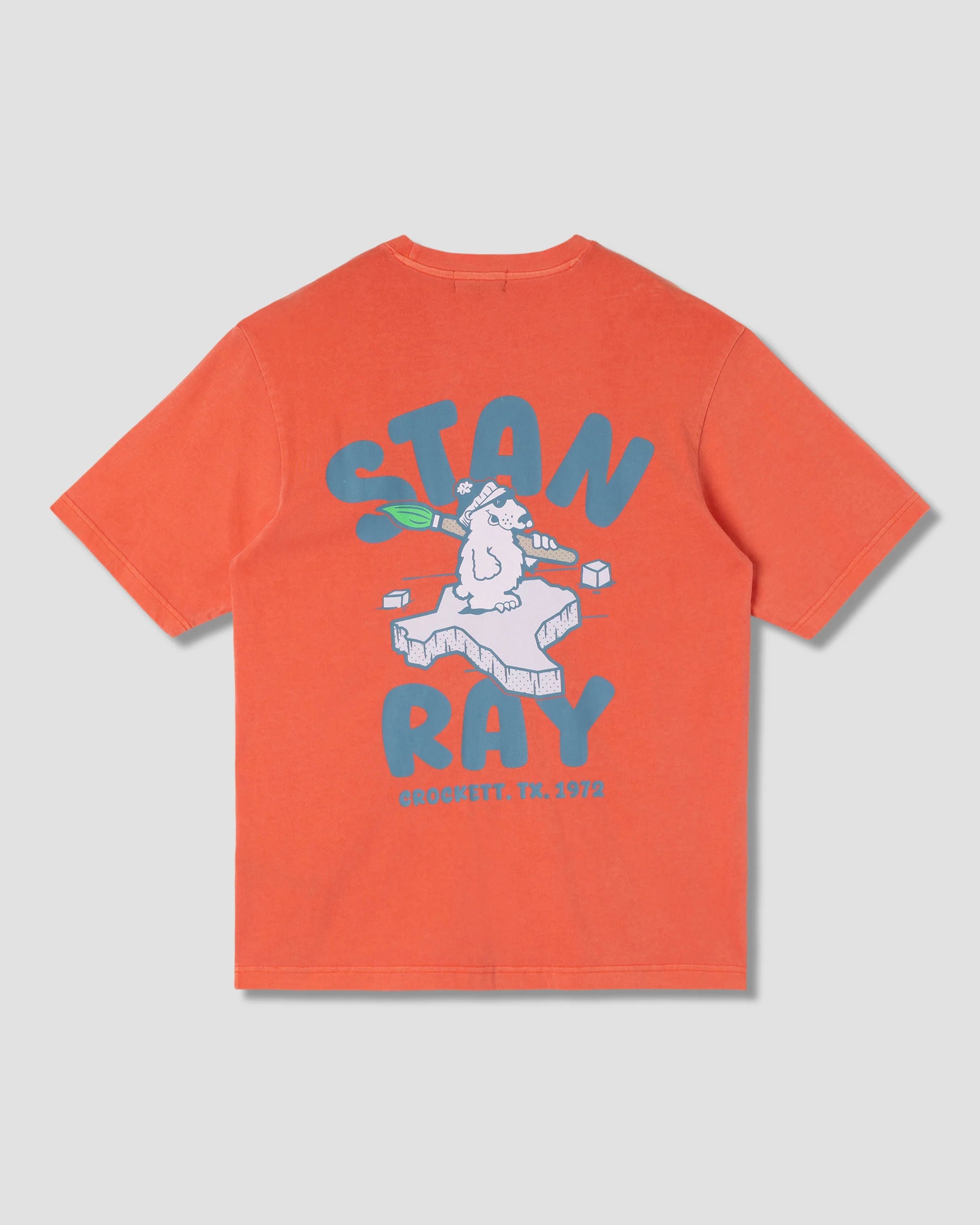 Orange t-shirt with graphic design and text on a gray background