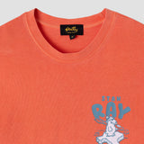Orange t-shirt with 'Stan Ray' graphic design on a light gray background