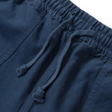 Close-up of blue shorts with drawstring on a white background
