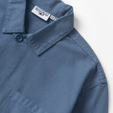Blue shirt with brand labels on a white background
