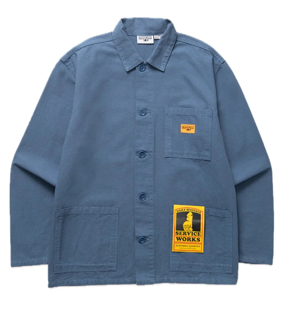 Blue jacket with a yellow patch on a white background