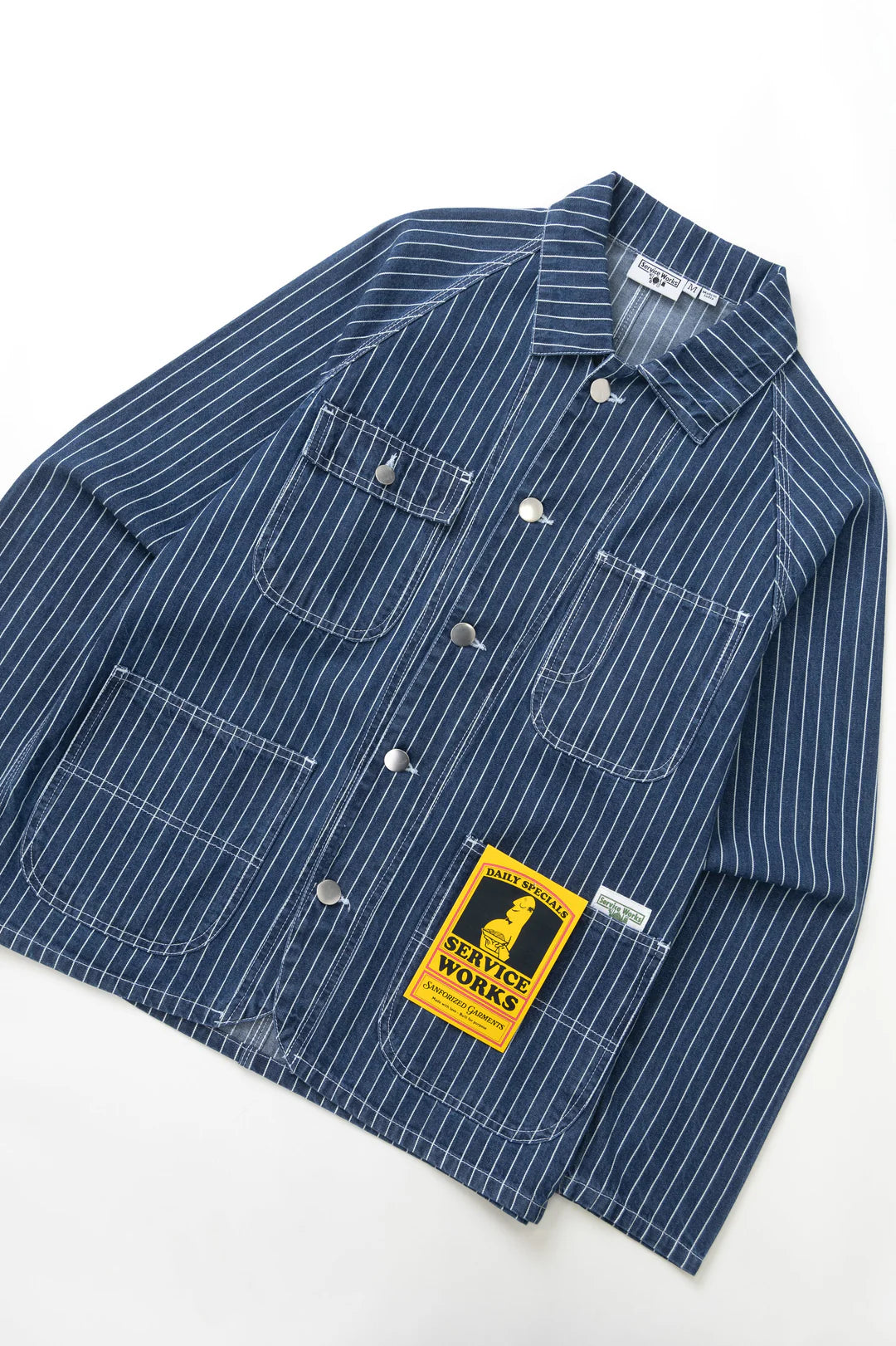 Blue striped shirt with a label on a white background
