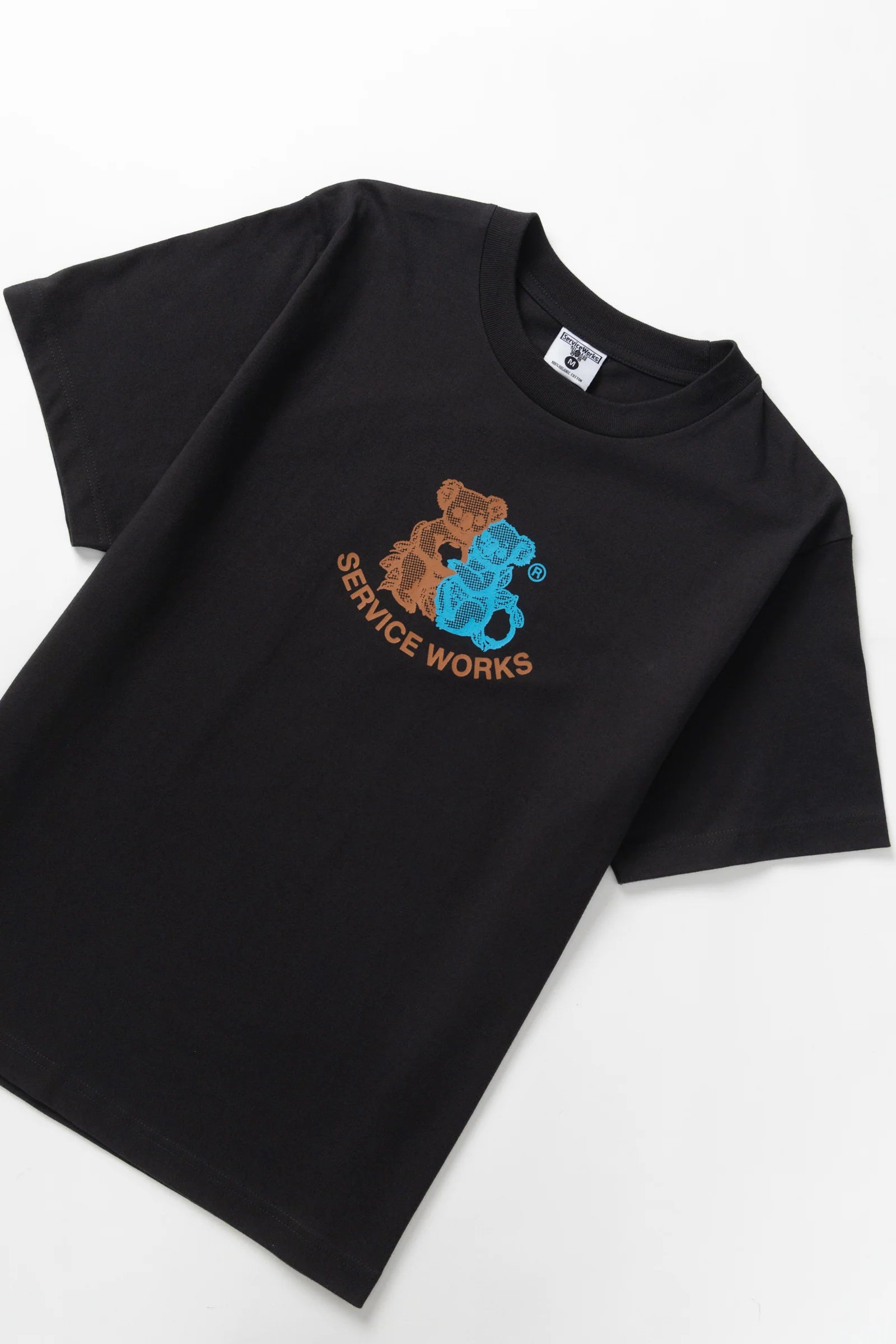 Black t-shirt with a logo featuring two bears on a white background