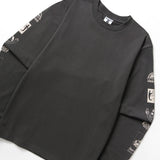 Black long-sleeve shirt with graphic designs on sleeves against a white background