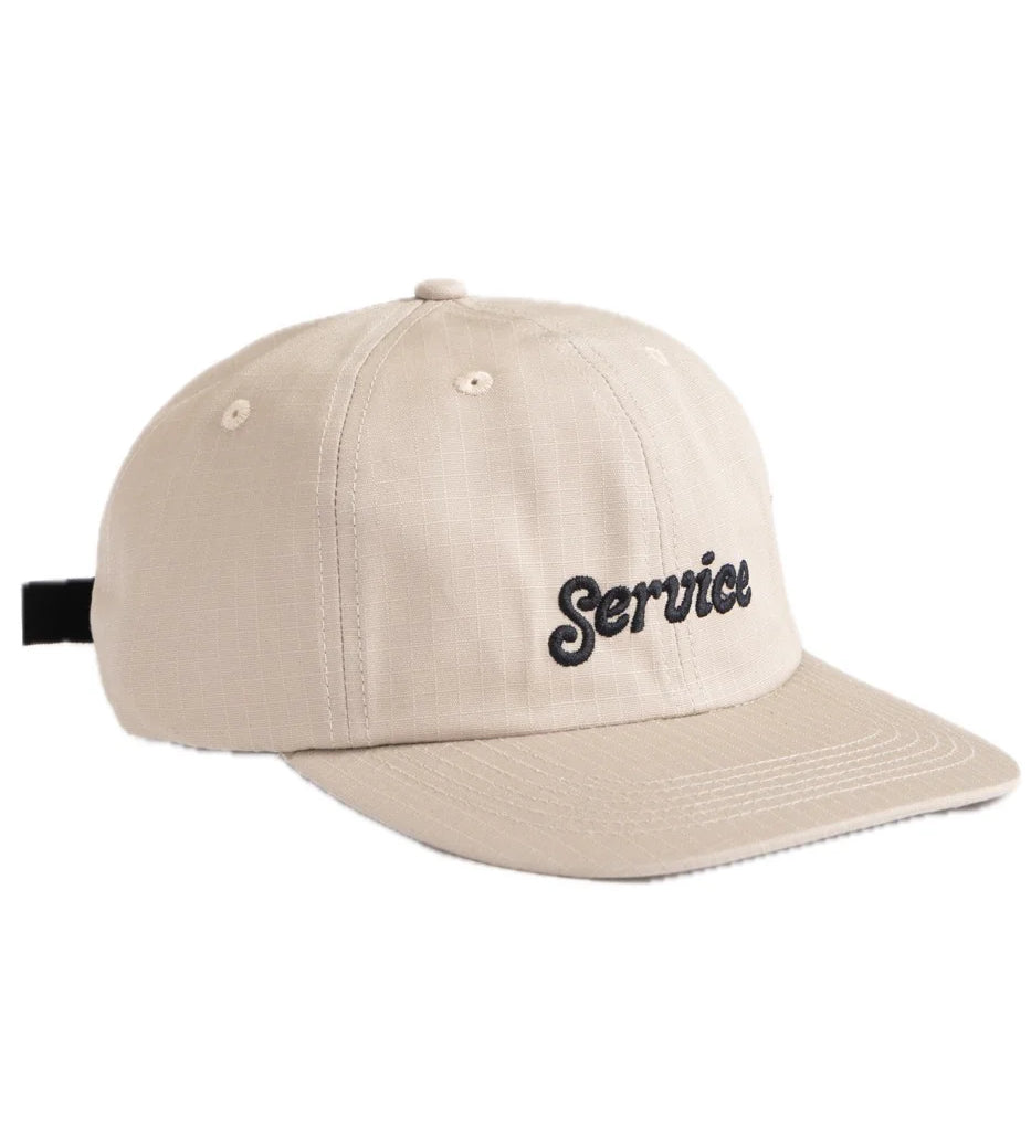 Beige cap with 'Service' embroidery on a white background