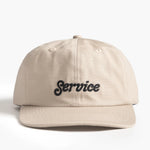 Beige cap with 'Service' text on a white background