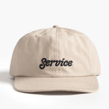 Beige cap with 'Service' text on a white background