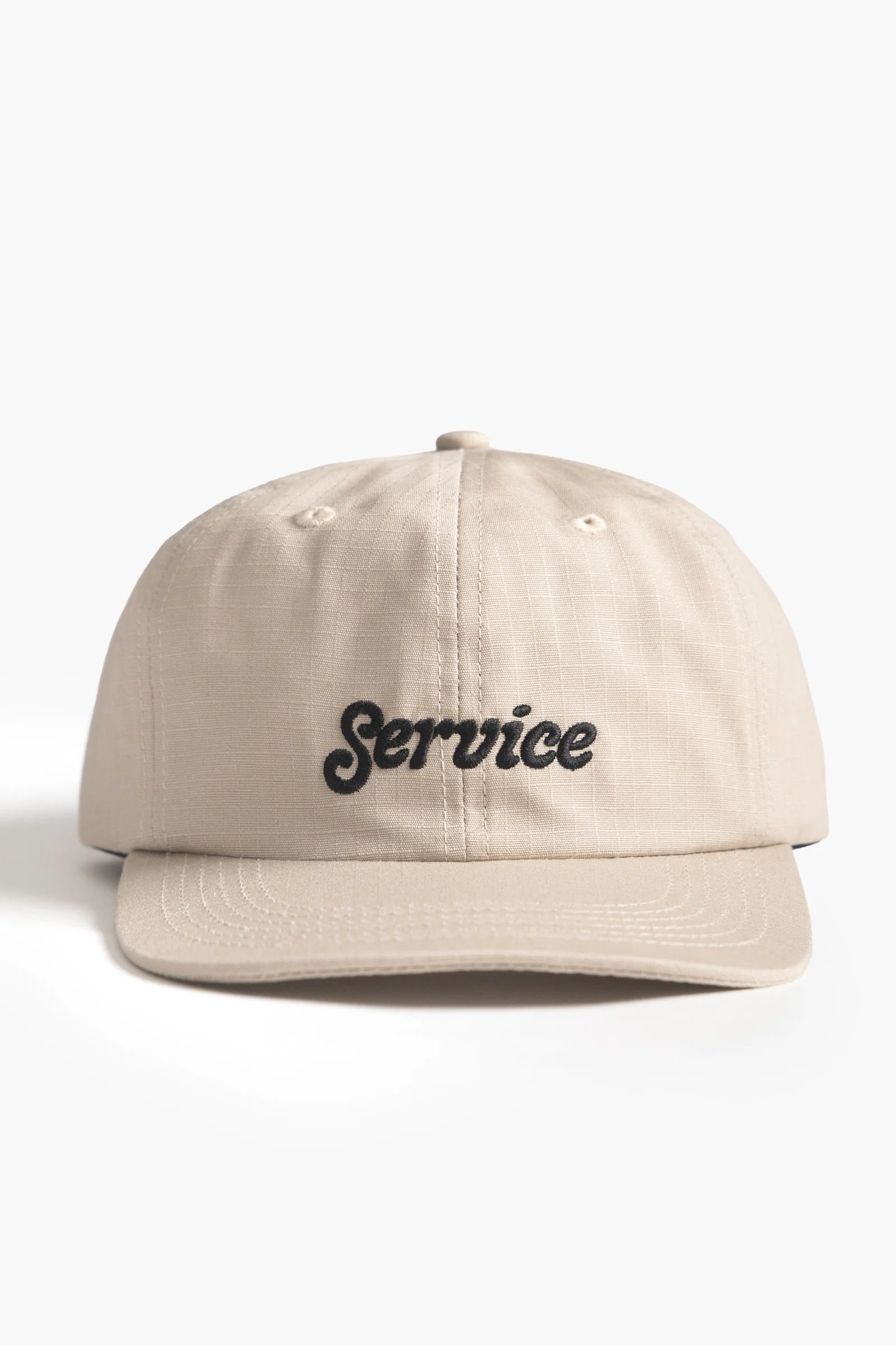 Beige cap with 'Service' text on a white background