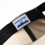 Close-up of a belt with a label on a white background