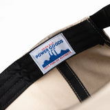 Close-up of a belt with a label on a white background