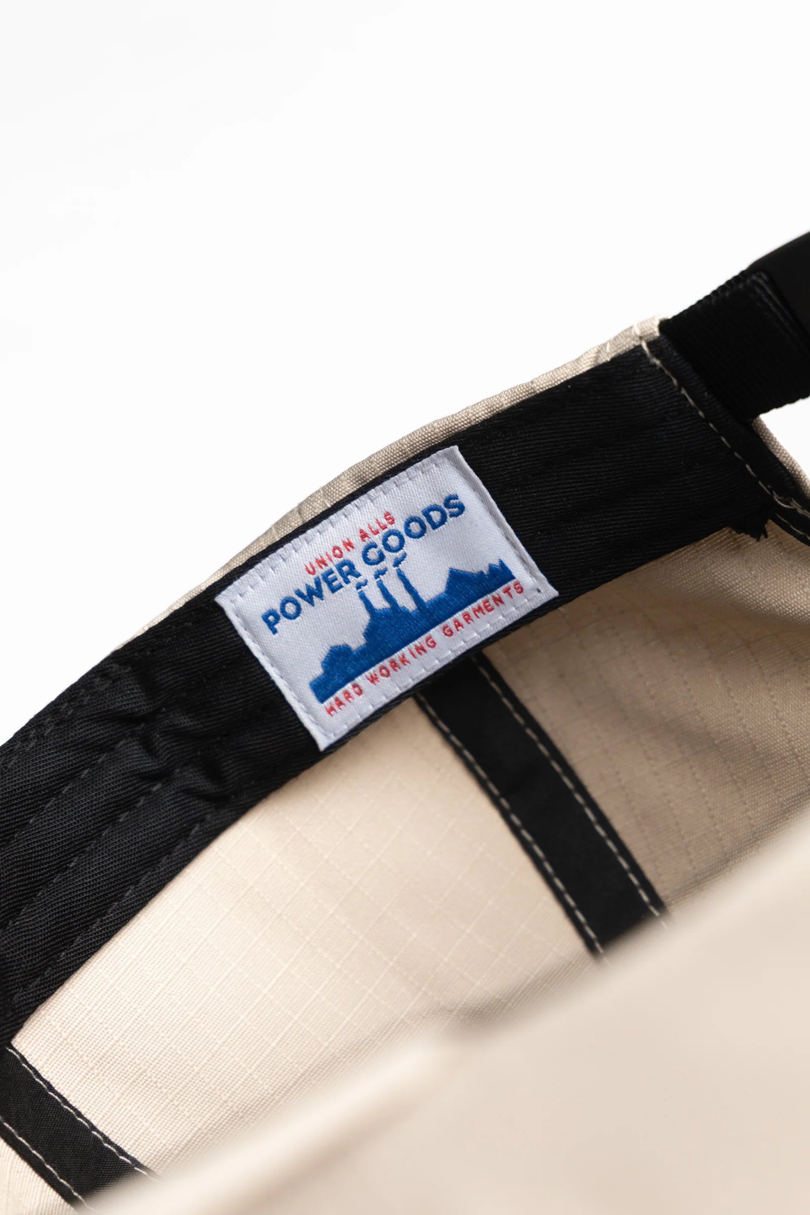 Close-up of a belt with a label on a white background