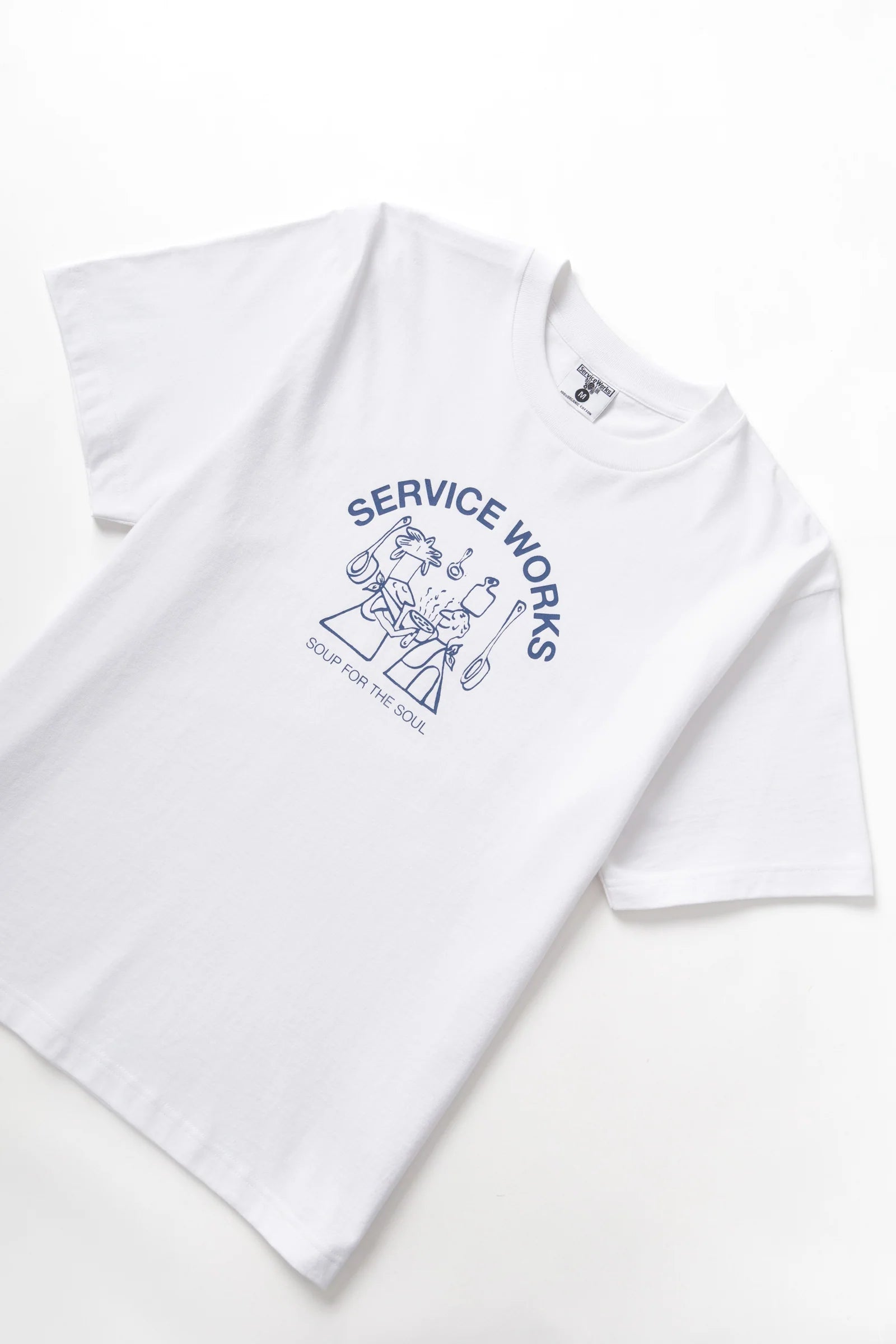 White t-shirt with blue graphic and text on a white background