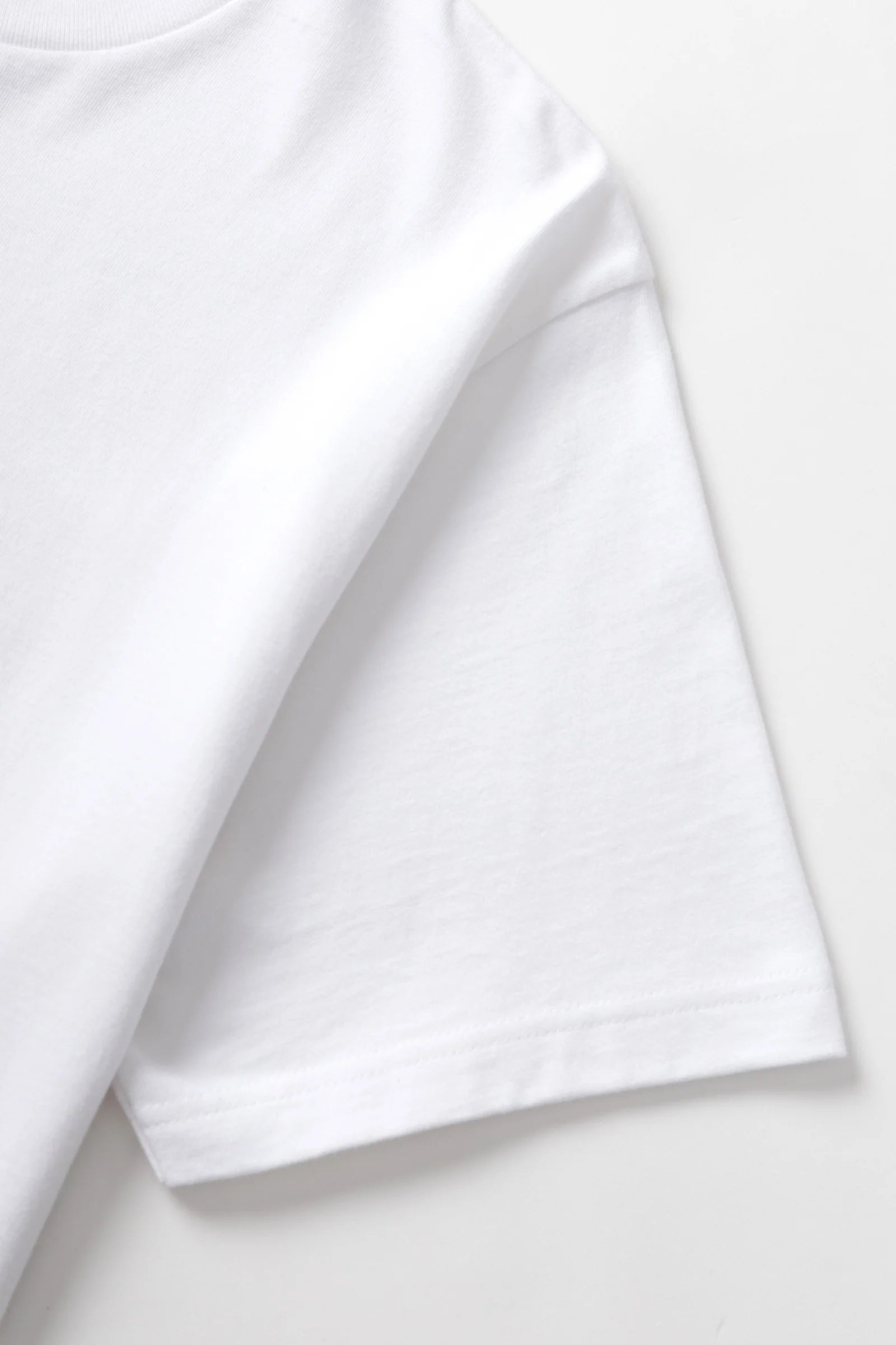 White t-shirt on a light gray background