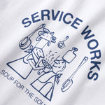 White t-shirt with blue graphic and text 'Service Works Soup for the Soul' on a white background