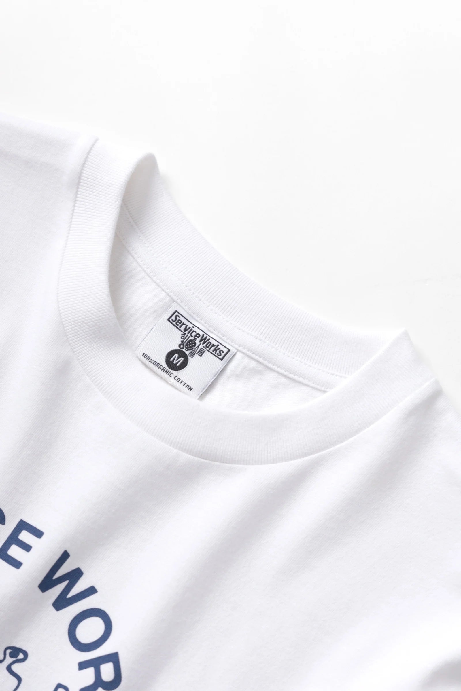 White t-shirt with a logo and text on a white background