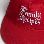 Red cap with 'Family Recipes' text on a white background