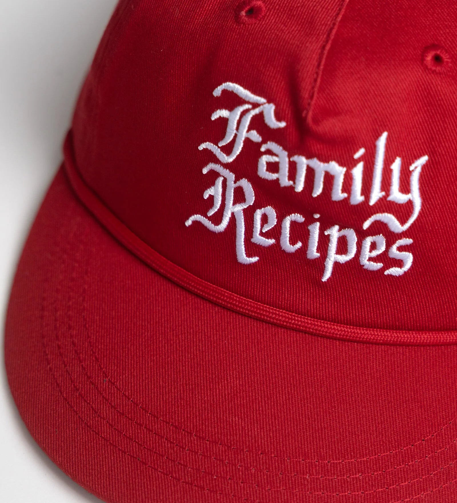 Red cap with 'Family Recipes' text on a white background