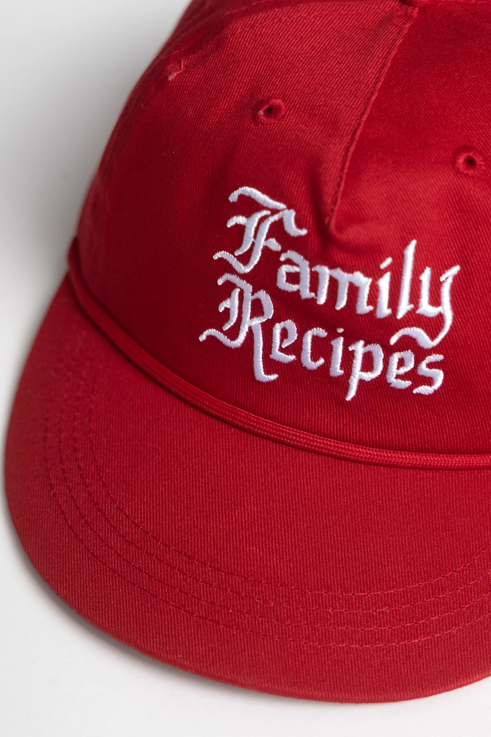 Red cap with 'Family Recipes' text on a white background