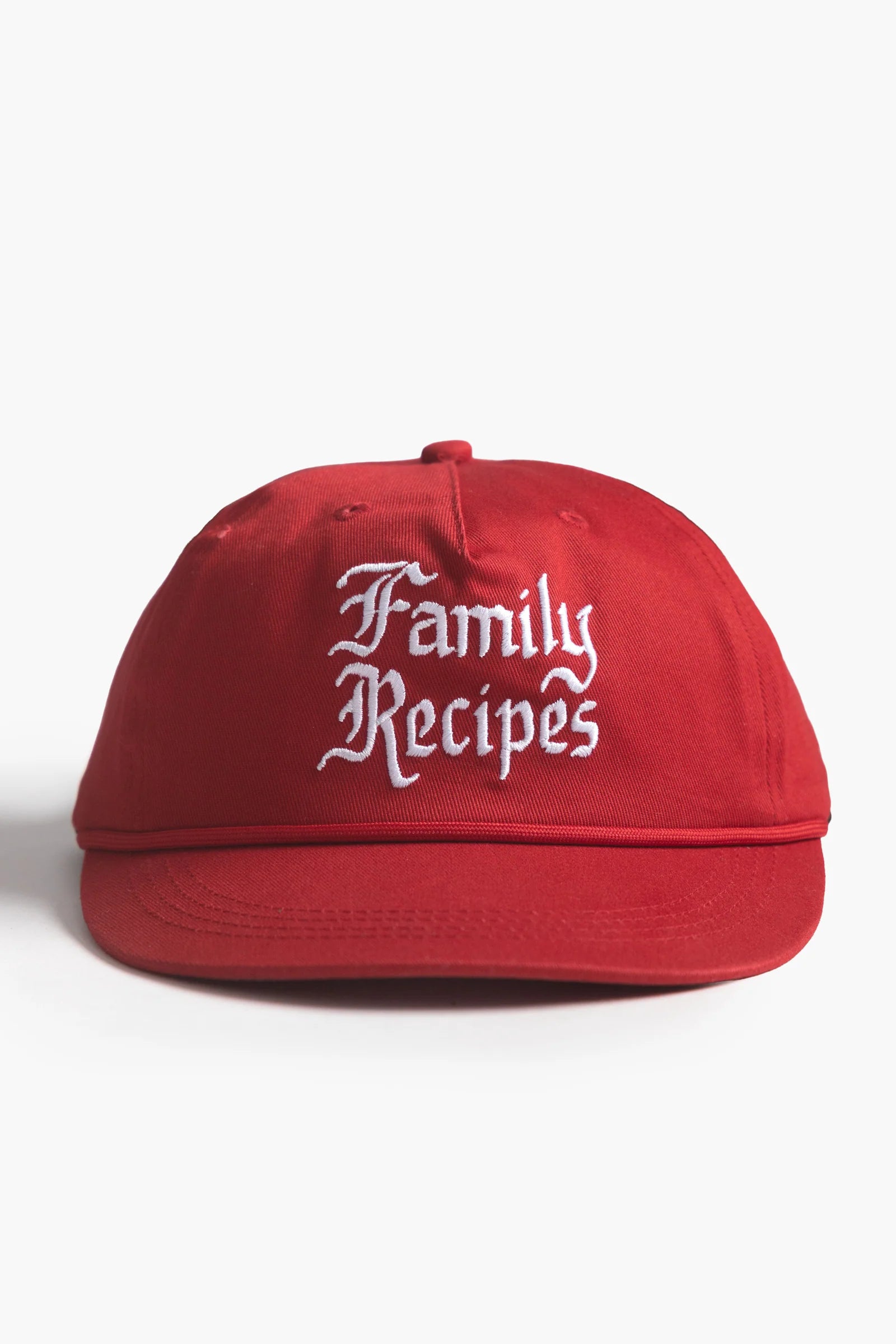 Red cap with 'Family Recipes' text on a white background