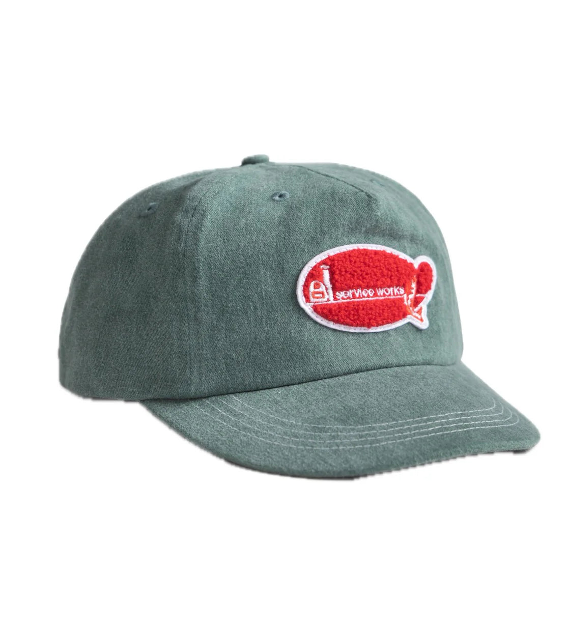 Green cap with a red and white logo on a white background
