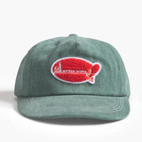 Green cap with a red and white logo on a white background