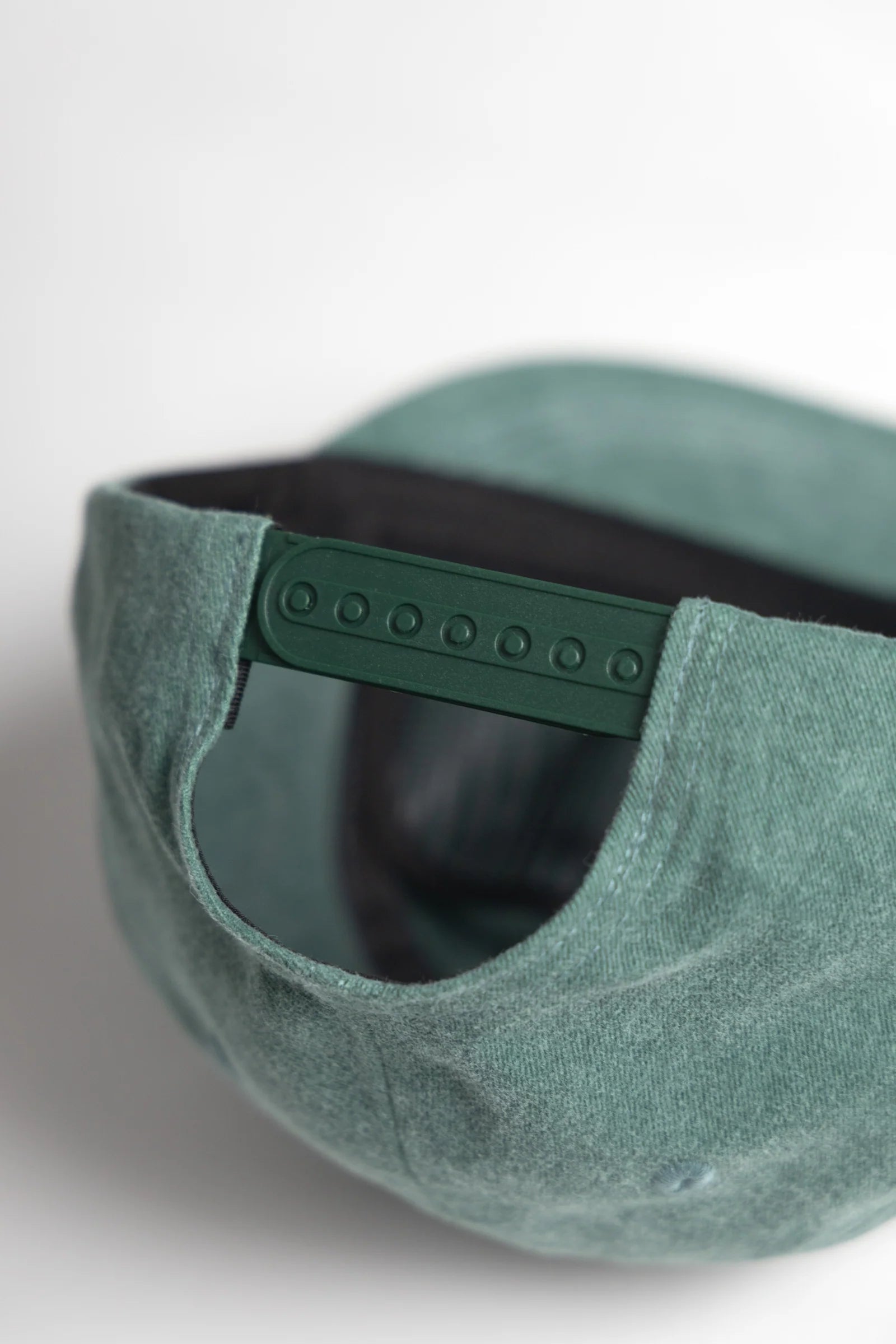 Green cap with a textured surface on a white background