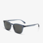 Sunglasses with a blue frame and dark lenses on a white background