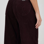 Brown corduroy pants with a visible brand label on a white background