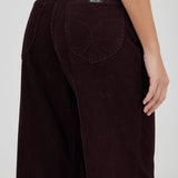 Brown corduroy pants with a visible brand label on a white background