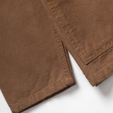 Close-up of brown pants on a white background
