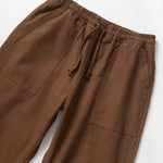 Brown pants with drawstring on a white background