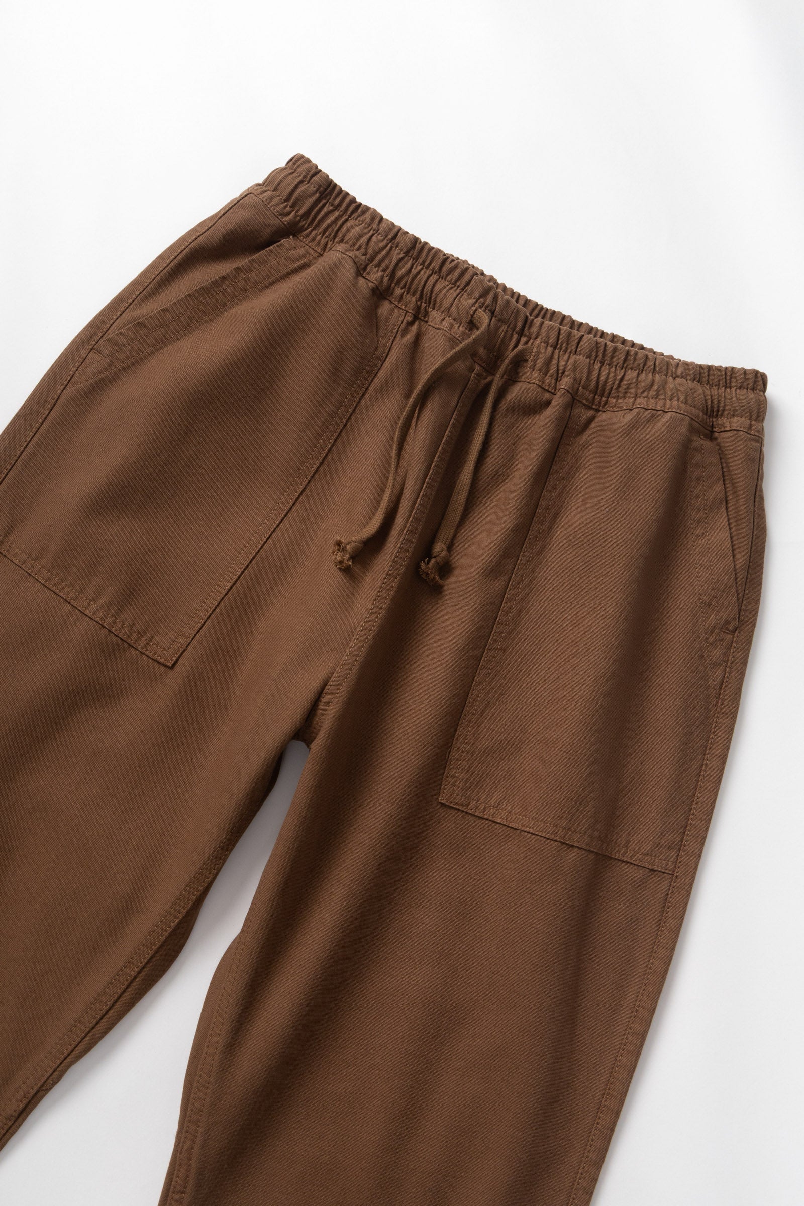 Brown pants with drawstring on a white background