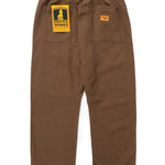 Brown pants with a yellow label on a white background