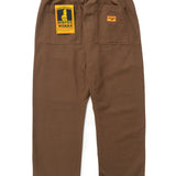 Brown pants with a yellow label on a white background