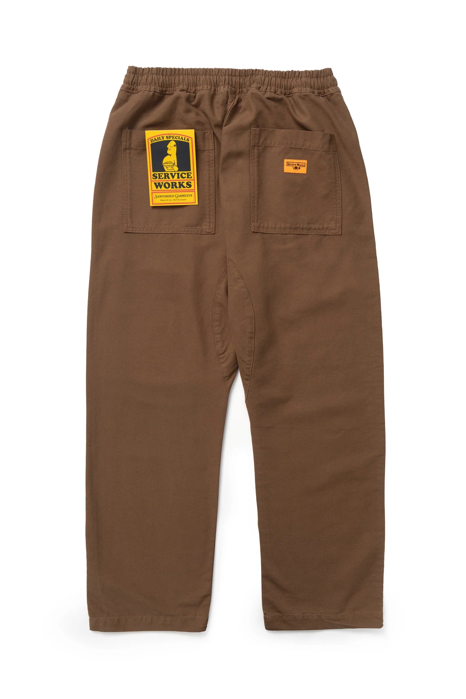 Brown pants with a yellow label on a white background
