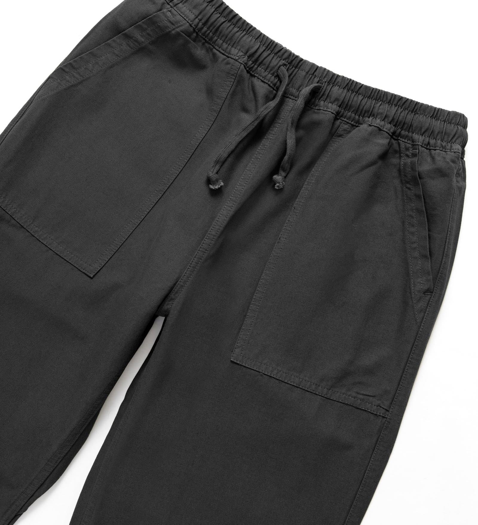 Black pants with drawstring waist on a white background