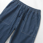 Blue pinstripe pants on a white background
