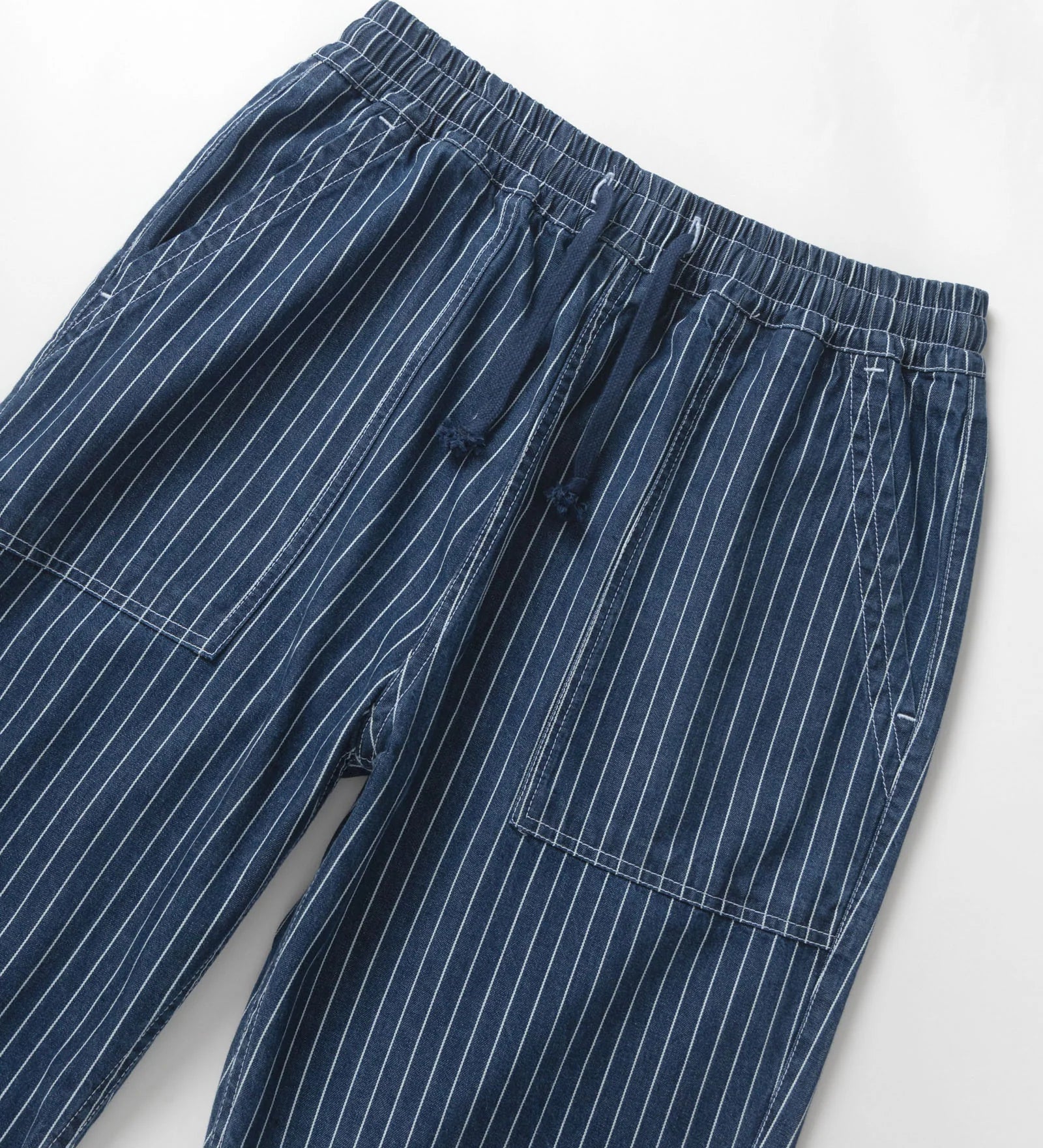 Blue pinstripe pants on a white background