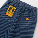 Blue pinstripe pants with a visible brand label on a white background